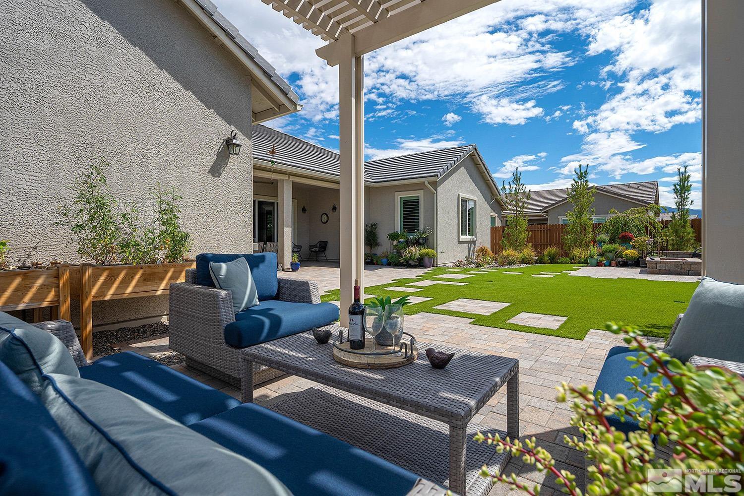 9579 Gazala Lane Reno, NV 89521 - Photo 19 of 40 a view of an house with backyard and patio