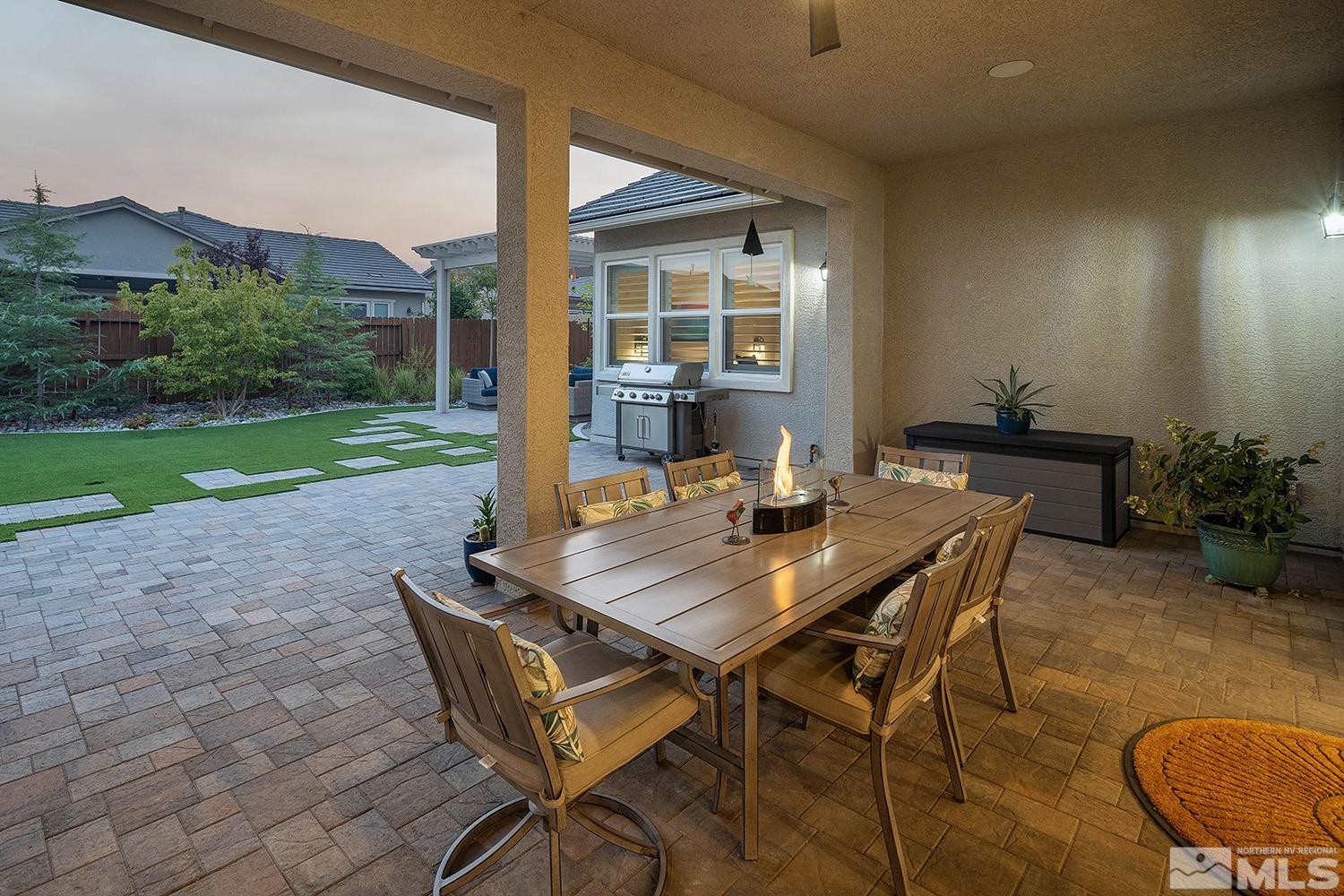 9579 Gazala Lane Reno, NV 89521 - Photo 25 of 40 a view of a patio with a table and chairs