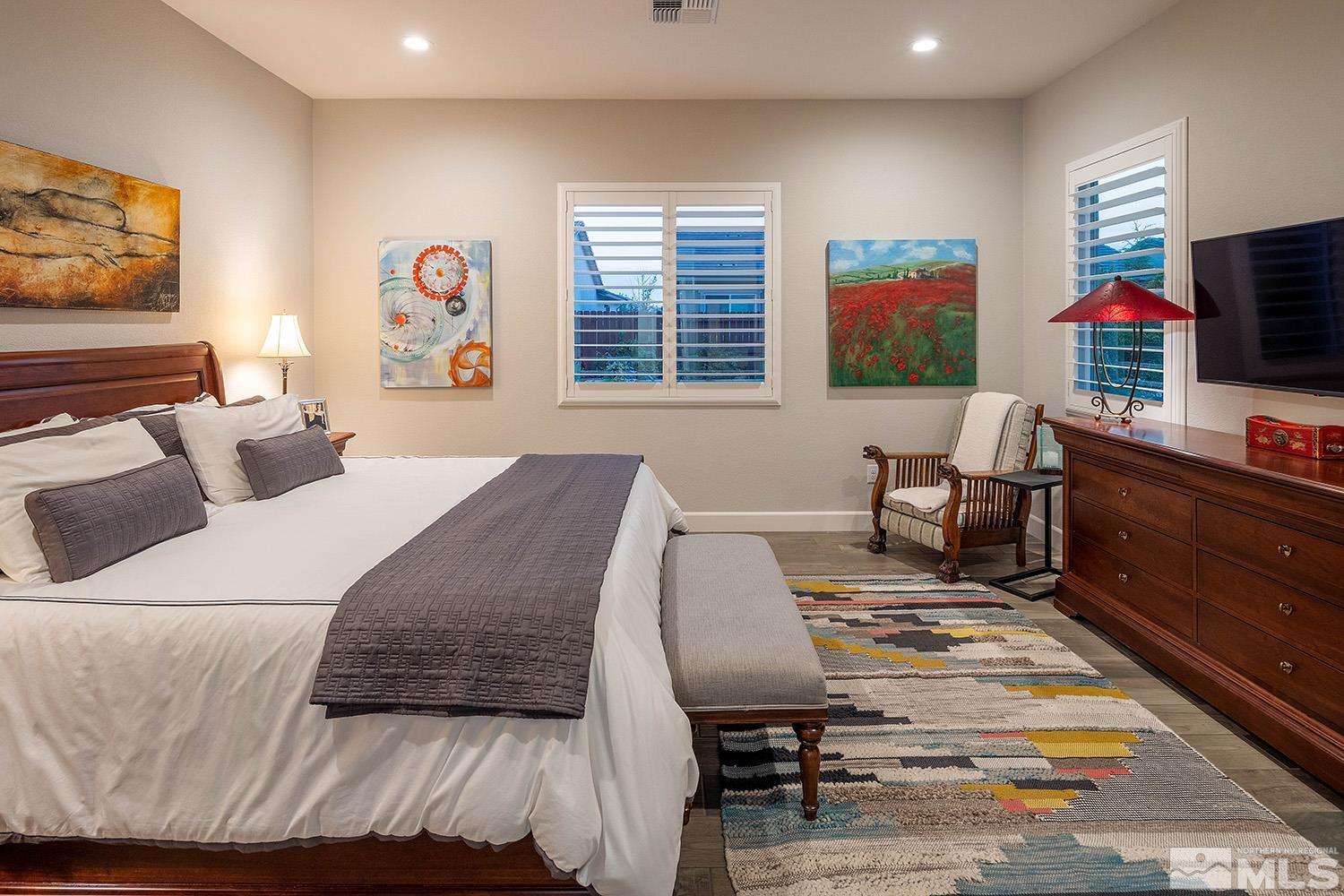 9579 Gazala Lane Reno, NV 89521 - Photo 30 of 40 a bedroom with a bed and flat screen tv
