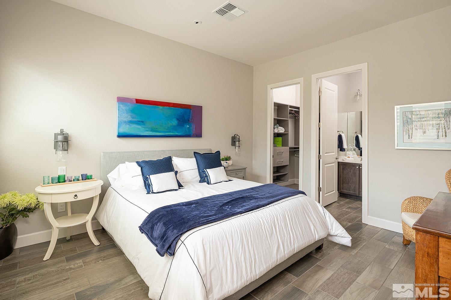 9579 Gazala Lane Reno, NV 89521 - Photo 31 of 40 a bedroom with a bed and a chair