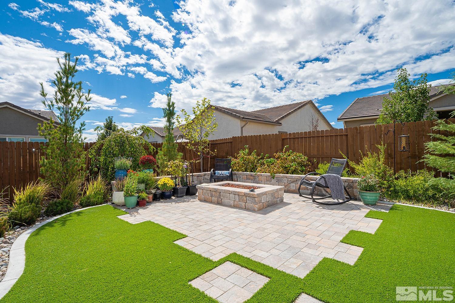 9579 Gazala Lane Reno, NV 89521 - Photo 36 of 40 a view of a house with backyard sitting area and garden