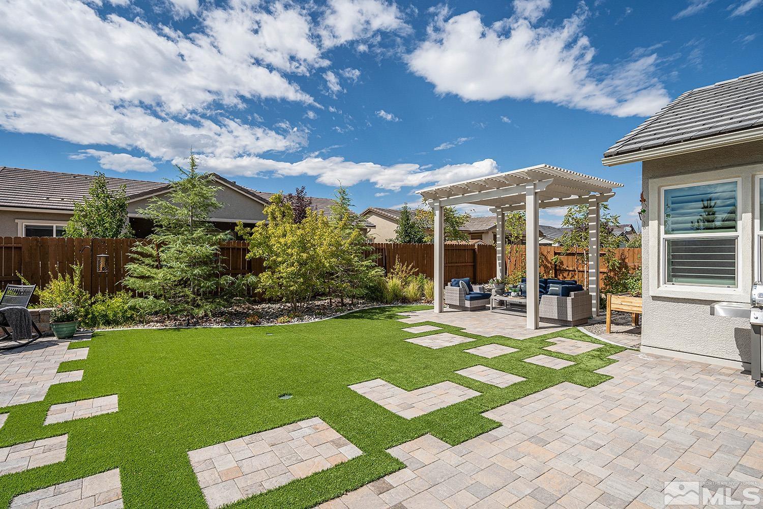 9579 Gazala Lane Reno, NV 89521 - Photo 37 of 40 a view of a house with garden and a patio