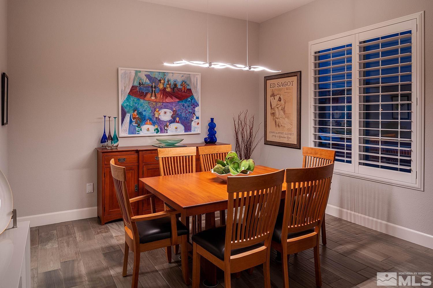 9579 Gazala Lane Reno, NV 89521 - Photo 9 of 40 a view of a dining room with furniture and wooden floor