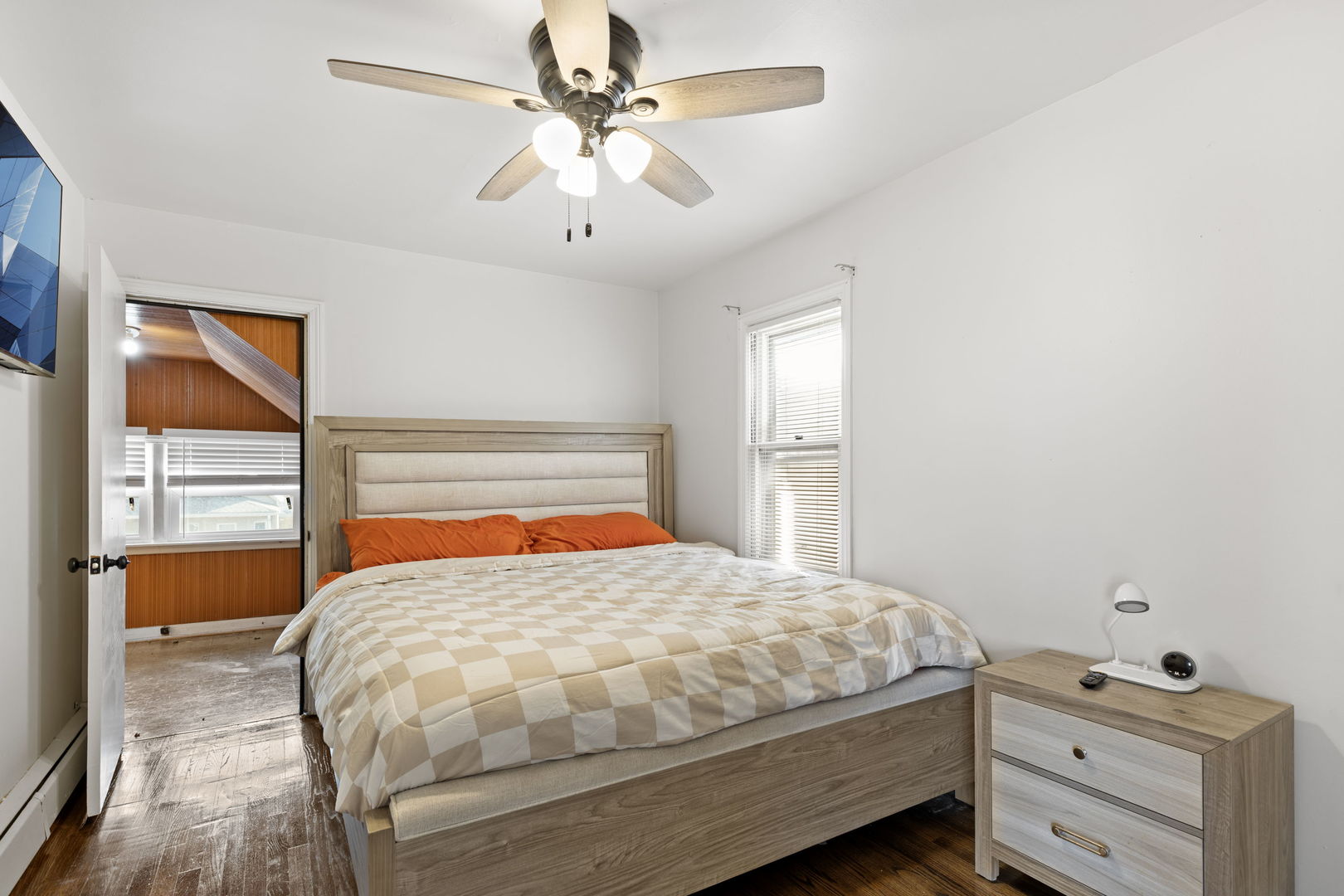 8438 South Morgan Street Chicago, IL 60620 - Photo 14 of 17 a bedroom with a bed and a chandelier