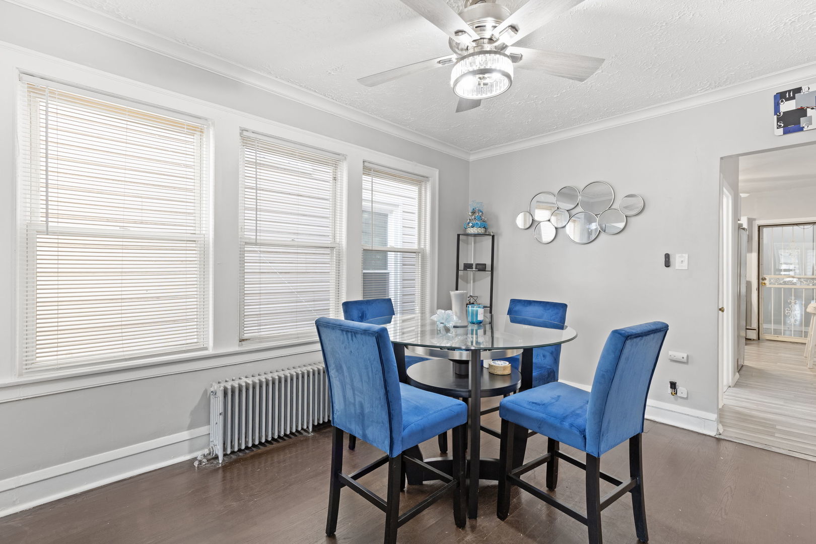 8438 South Morgan Street Chicago, IL 60620 - Photo 5 of 17 a view of a dining room with furniture a chandelier and a window