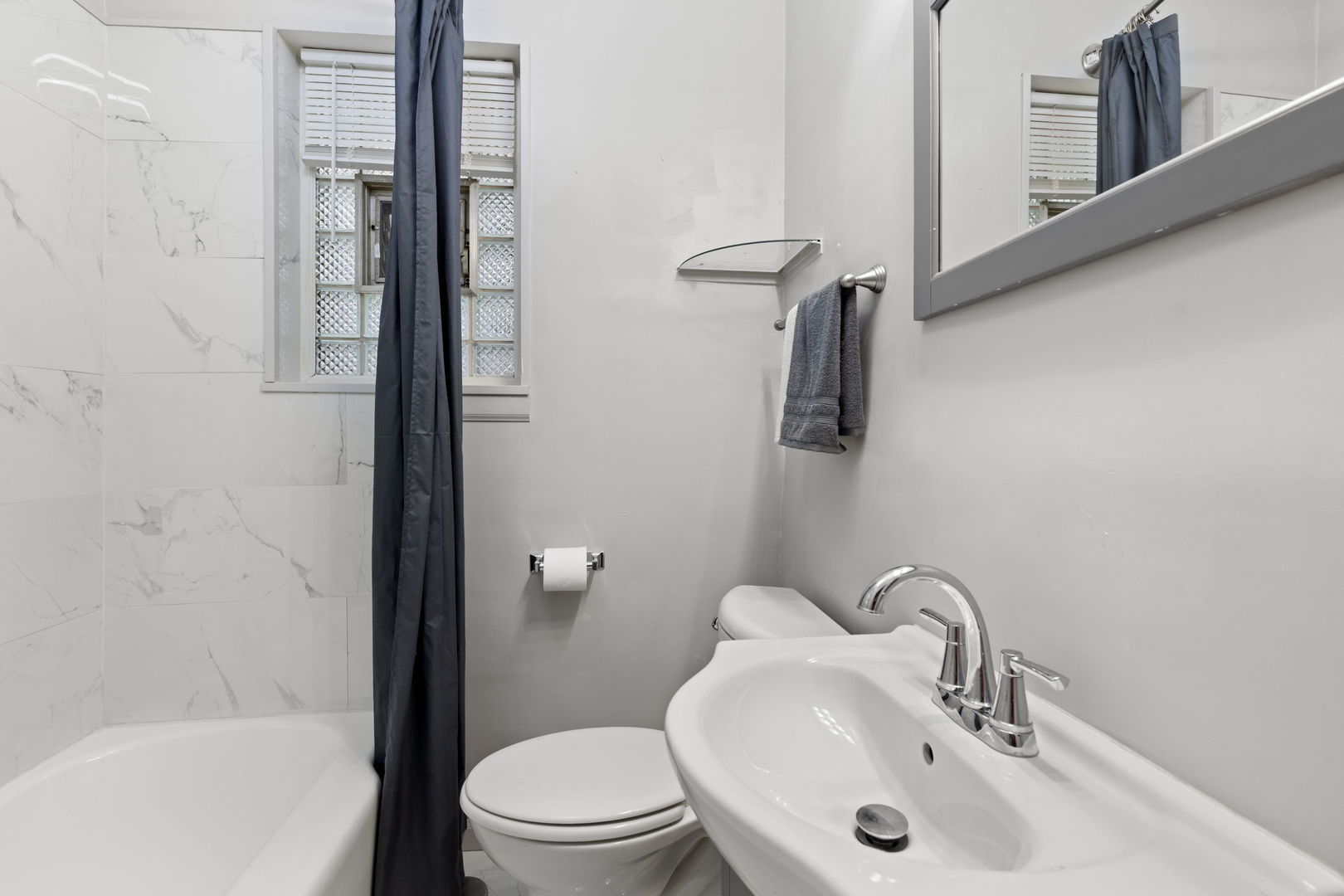 8438 South Morgan Street Chicago, IL 60620 - Photo 10 of 17 a bathroom with a sink toilet and shower