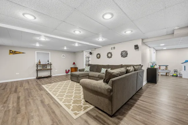 a view of a house with backyard and sitting area