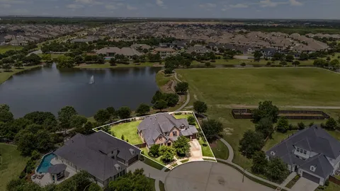 an aerial view of a house with a lake view