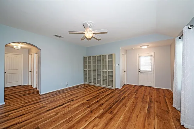 a view of a kitchen with a sink and a refrigerator