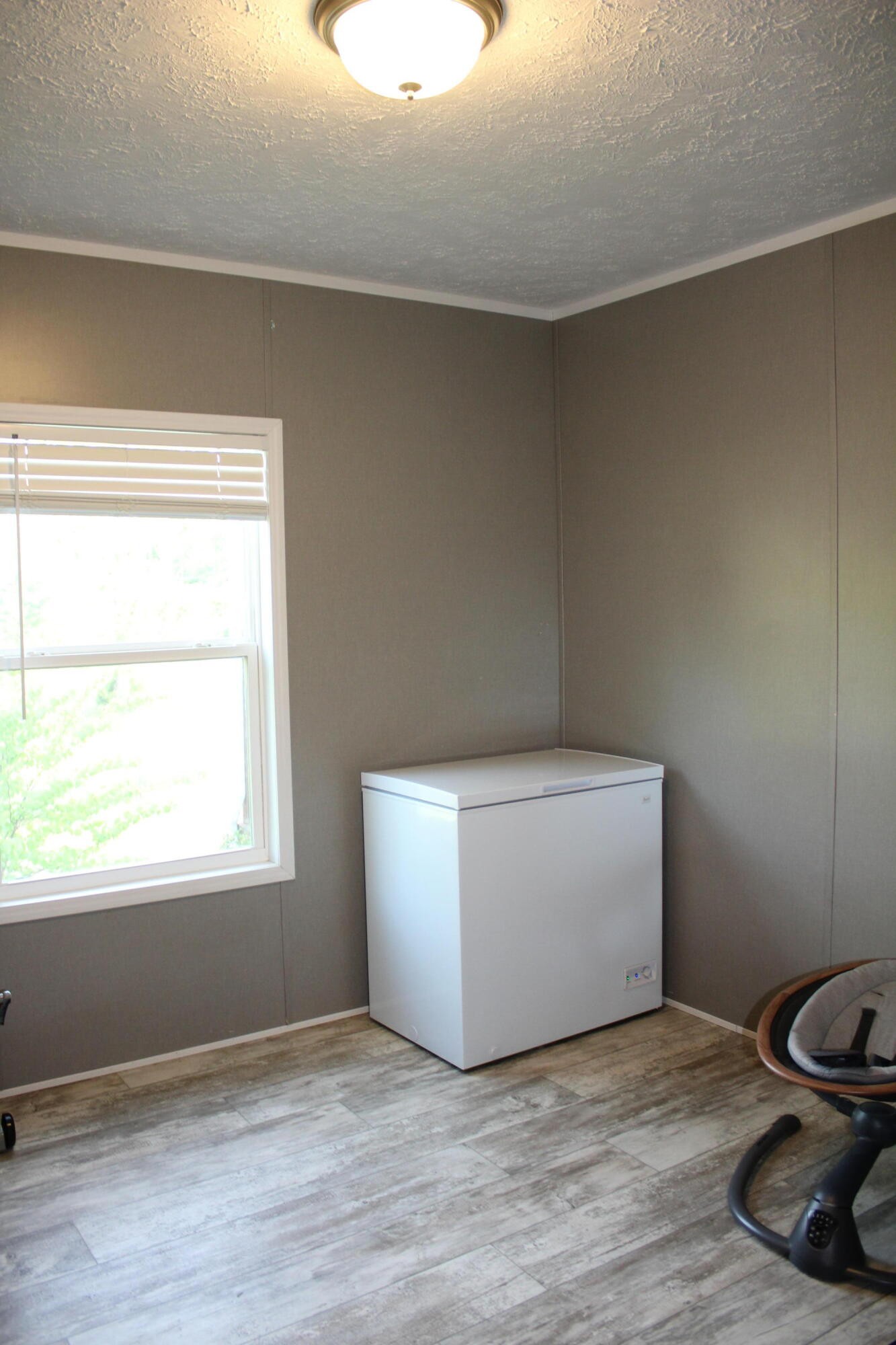 658 Stone Road Benton, TN 37307 - Photo 16 of 30 a view of an empty room with wooden floor and a window