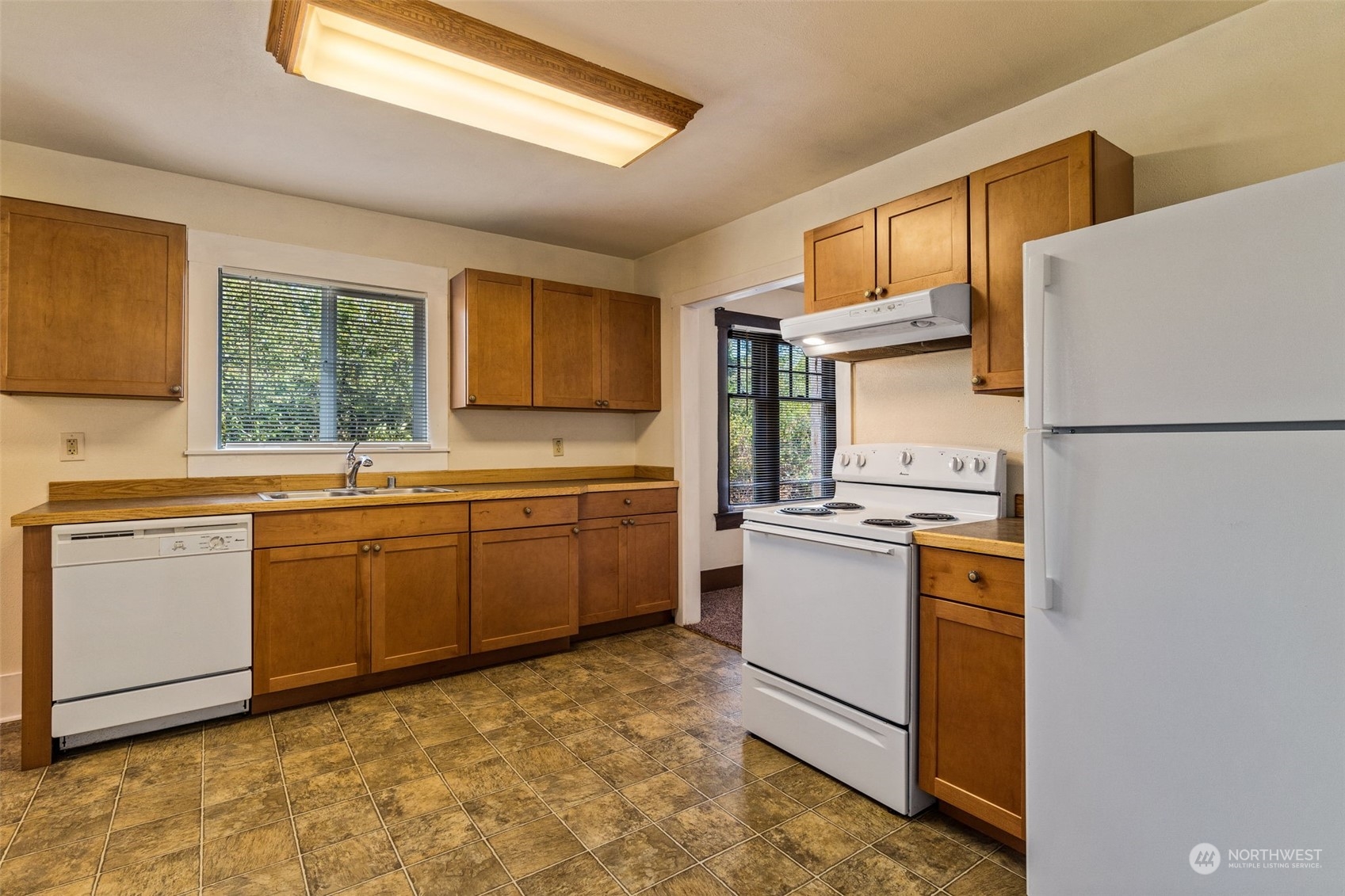 18127 Case Road Southwest Rochester, WA 98579 - Photo 14 of 37 a kitchen with a sink stove and refrigerator