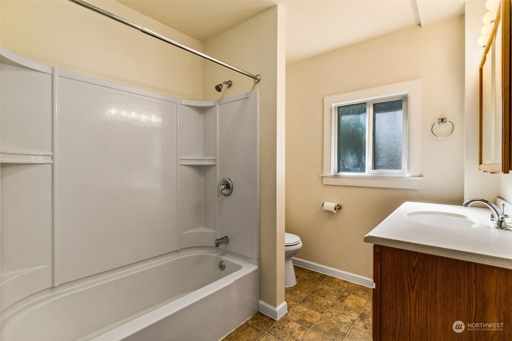 18127 Case Road Southwest Rochester, WA 98579 - Photo 16 of 37 a bathroom with a sink and a bathtub