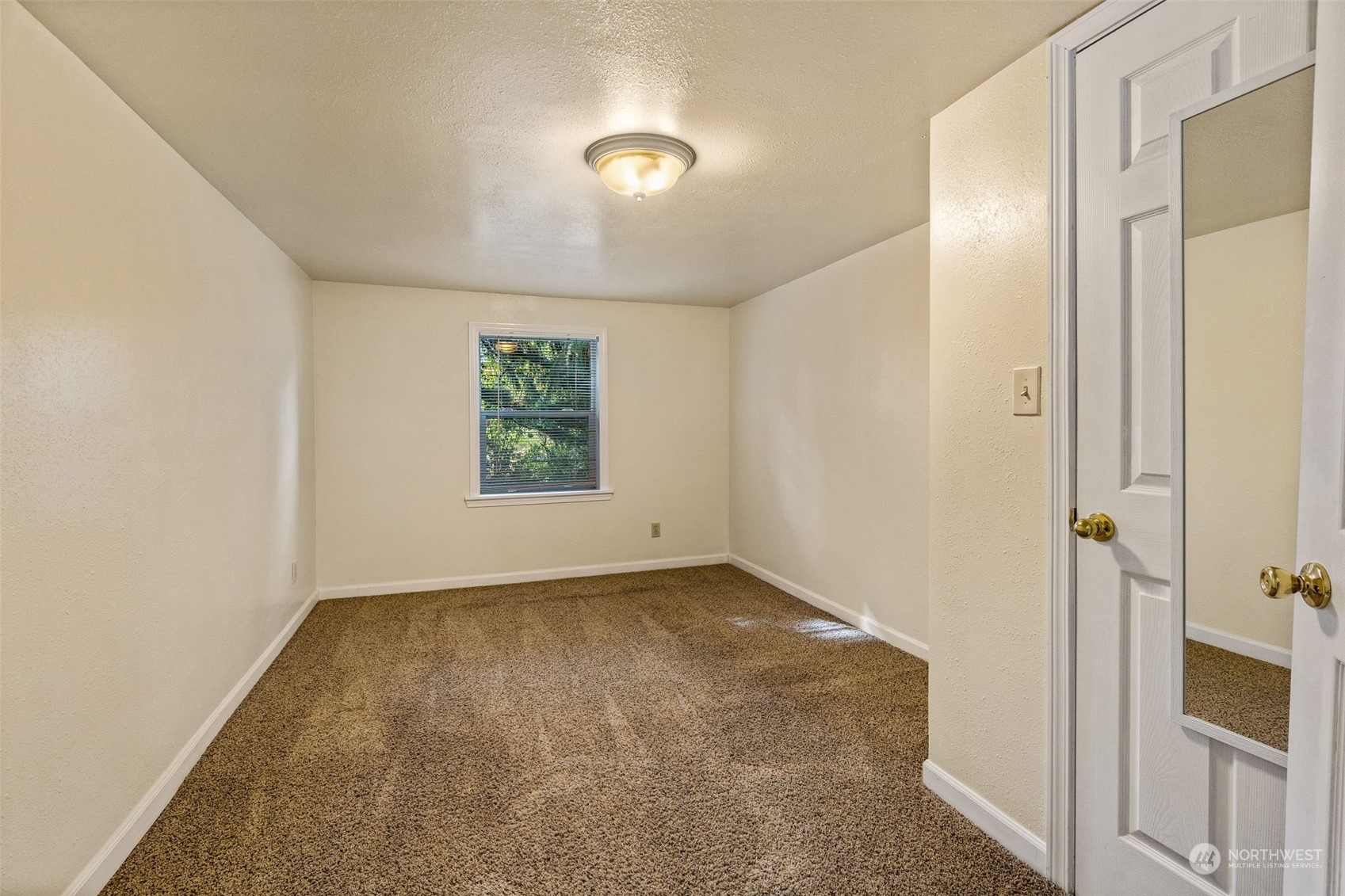 18127 Case Road Southwest Rochester, WA 98579 - Photo 29 of 37 an empty room with windows