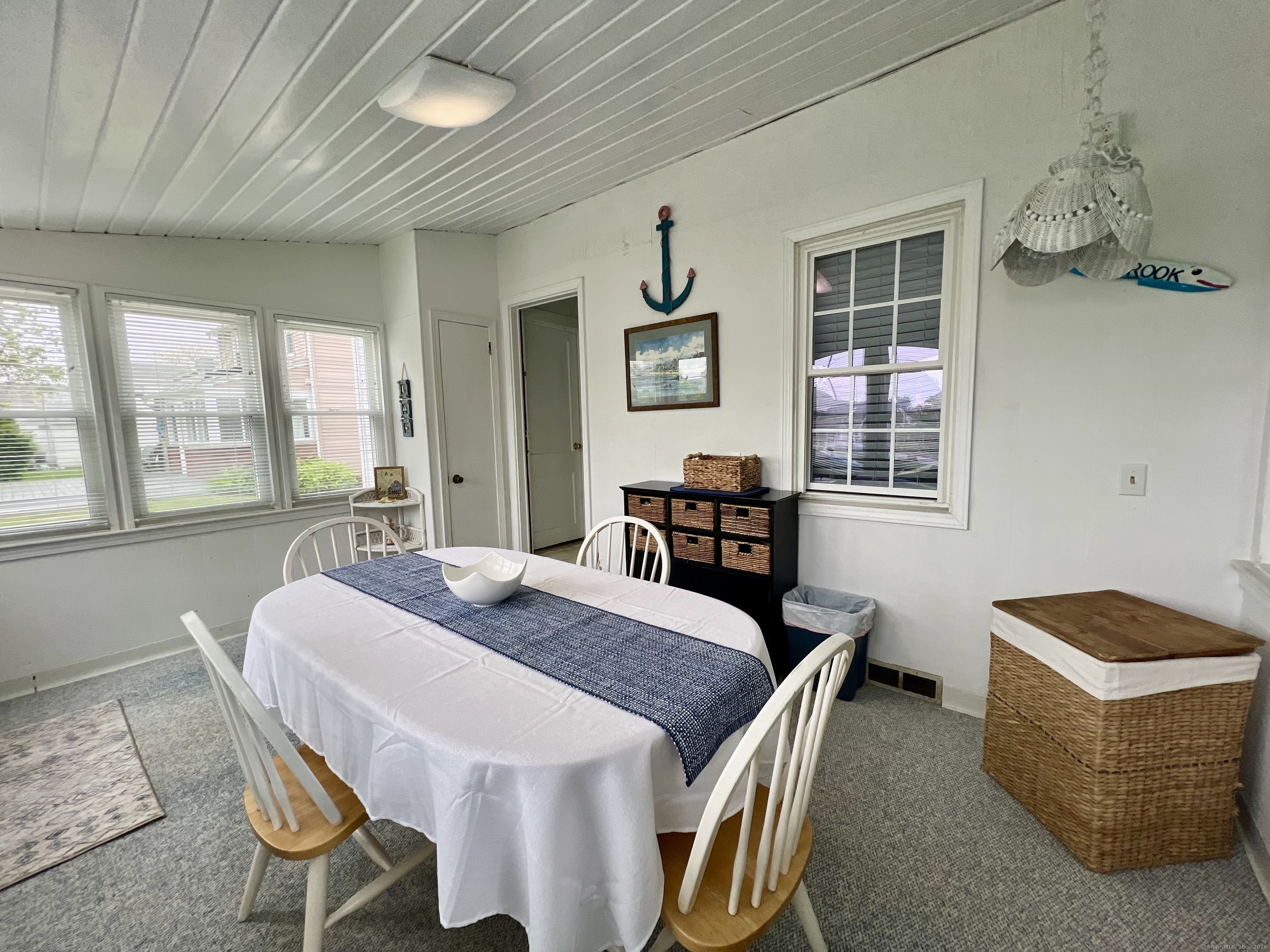38 Seabreeze Road Old Saybrook, CT 06475 - Photo 12 of 19 a view of a dining room with furniture window and outside view