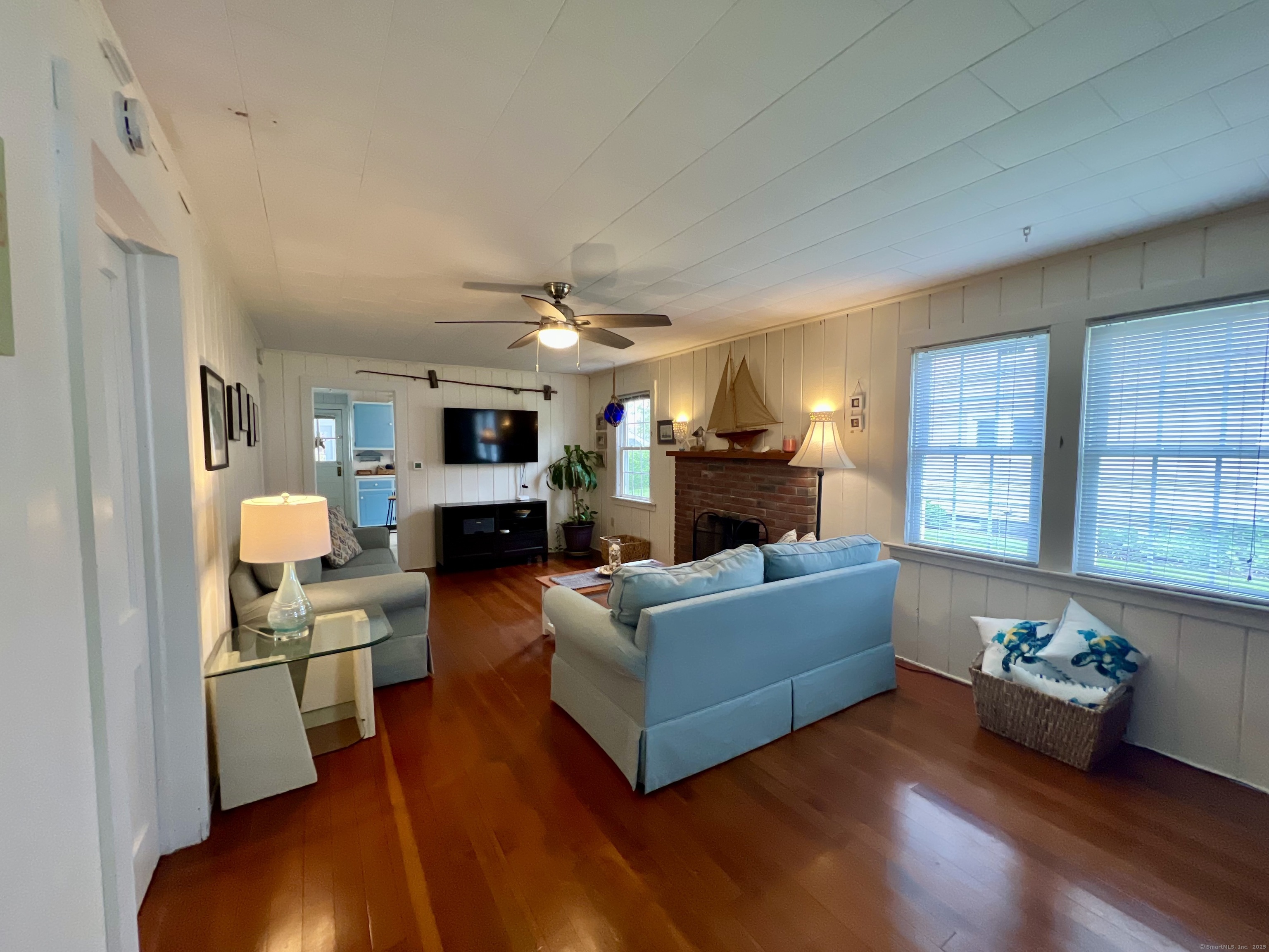 38 Seabreeze Road Old Saybrook, CT 06475 - Photo 13 of 19 a living room with furniture and a fireplace
