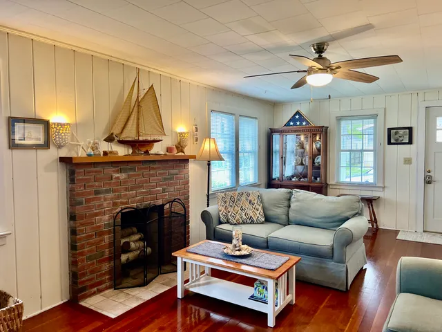 a living room with furniture and a fireplace