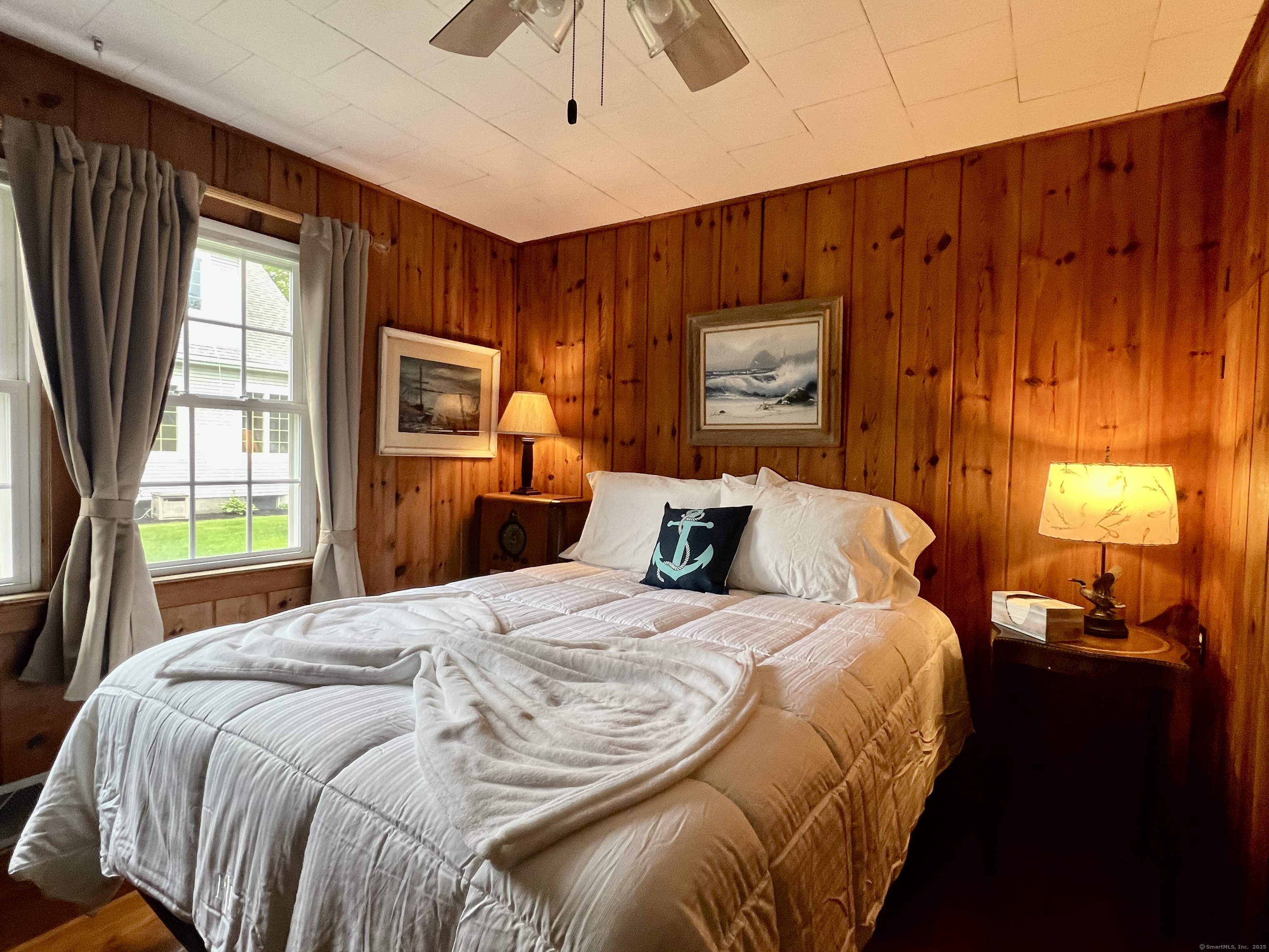 38 Seabreeze Road Old Saybrook, CT 06475 - Photo 15 of 19 a bedroom with a bed and a window