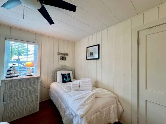 a bedroom with a bed and a dresser