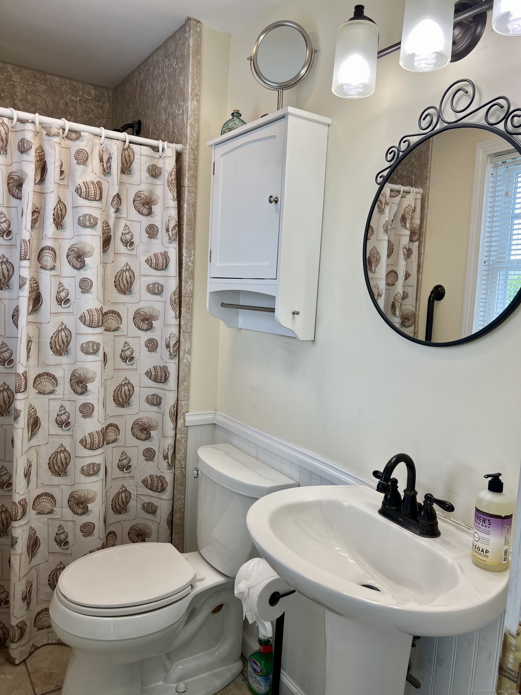 38 Seabreeze Road Old Saybrook, CT 06475 - Photo 19 of 19 a bathroom with a sink toilet and mirror