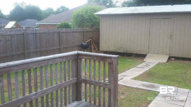 8451 Kendall Court Mobile, AL 36695 - Photo 26 of 33 Deck off breakfast room. Sidewalk to shed/workshop.