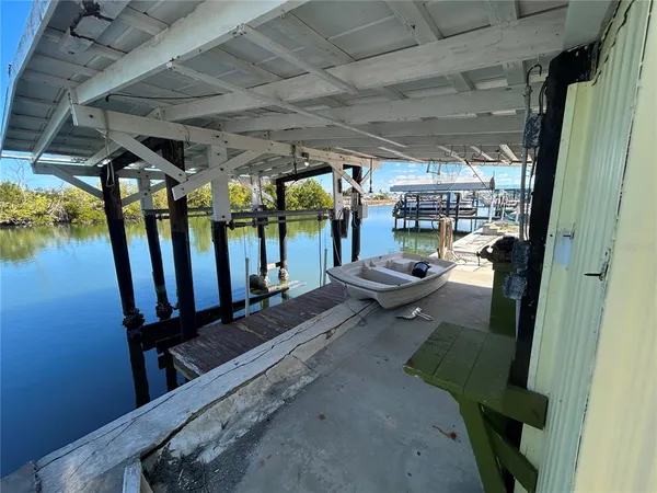 a living room with lots of furniture and a window