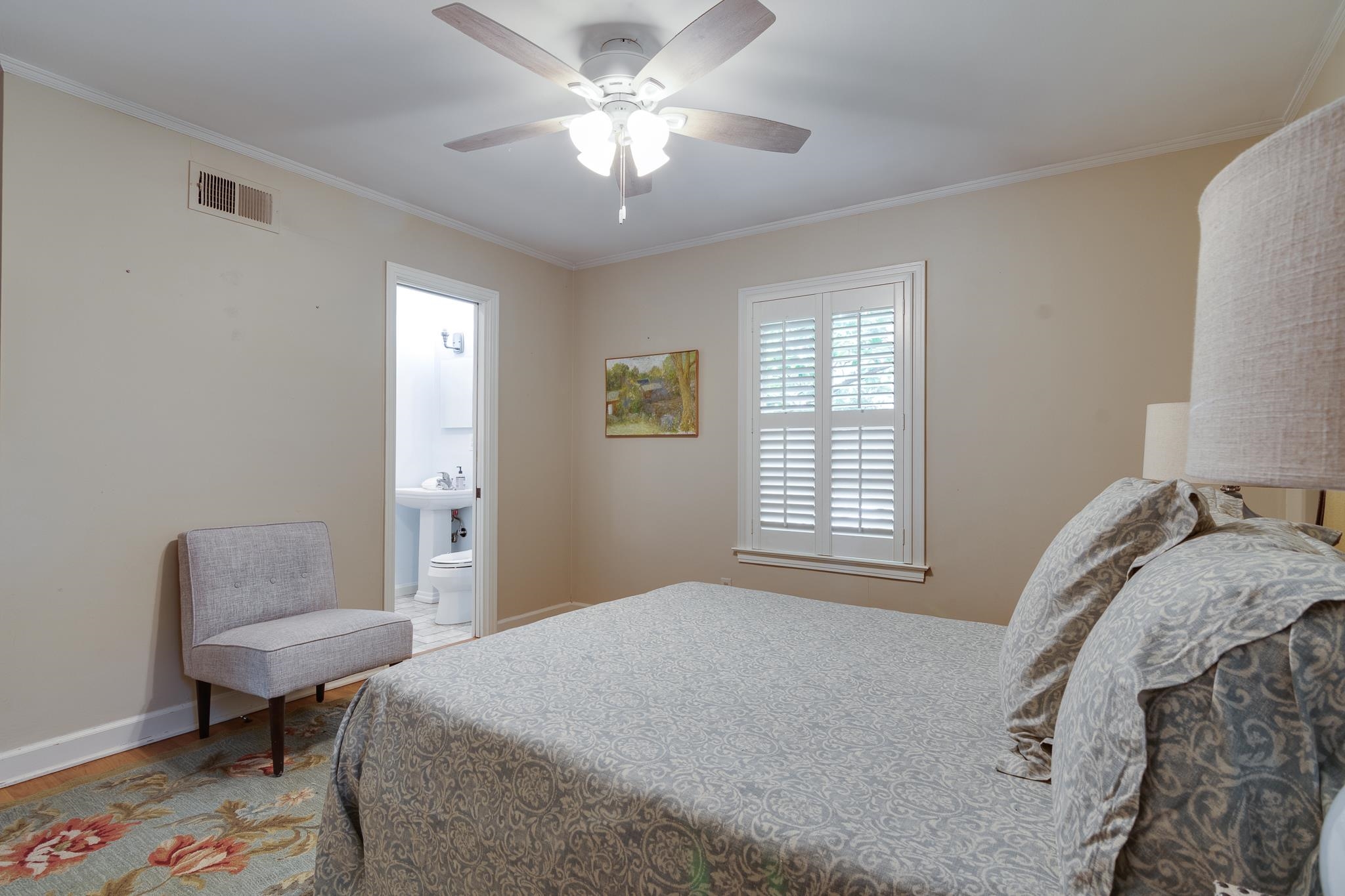 4281 Minden Road Memphis, TN 38117 - Photo 24 of 40 a bedroom with a bed and a chandelier