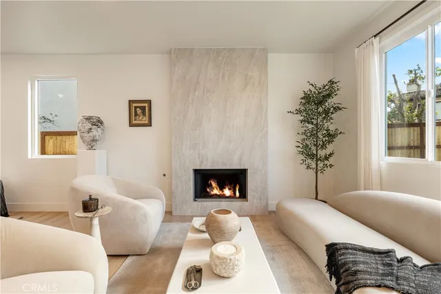a kitchen with a stove a sink and cabinets