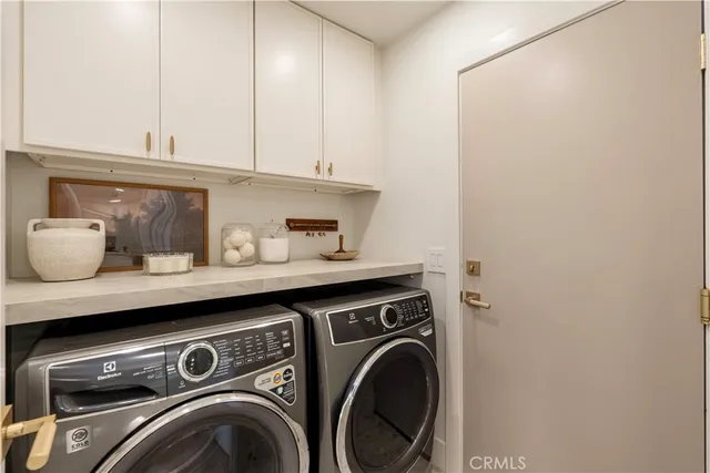 a view of a room with a table and chairs