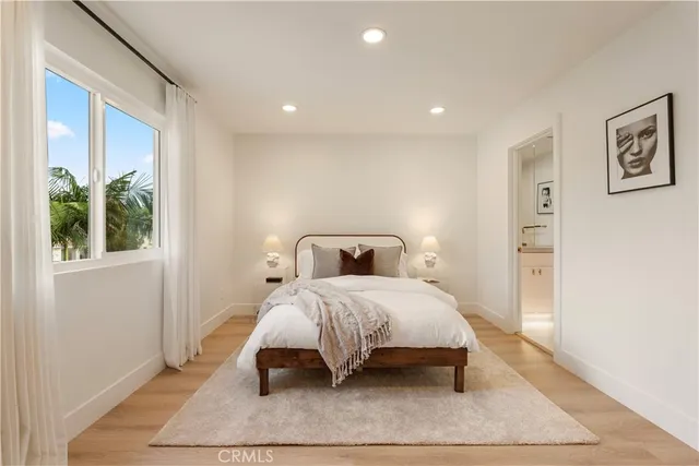 a bathroom with a tub shower and mirror