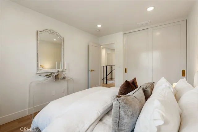 a front view of a house with garden and yard