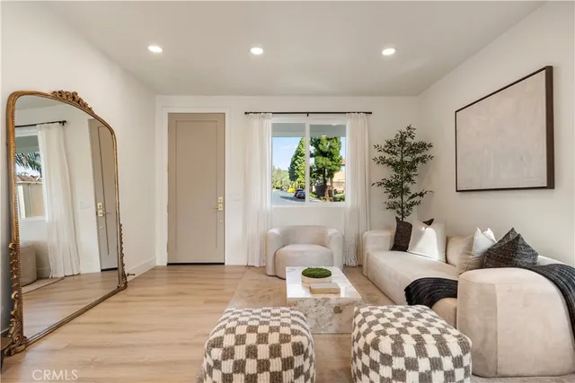 a bedroom with furniture and a potted plant