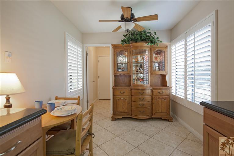 72384 Ridgecrest Lane Palm Desert, CA 92260 - Photo 12 of 23 a kitchen that has a table and chairs in it