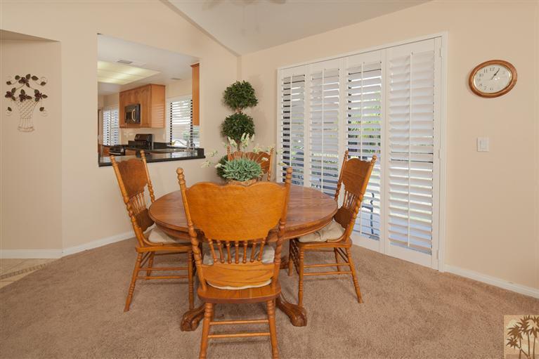 72384 Ridgecrest Lane Palm Desert, CA 92260 - Photo 13 of 23 a dining room with furniture and a window