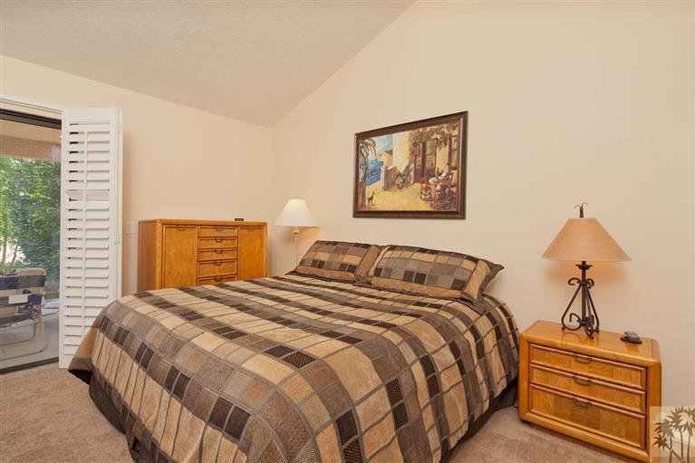 72384 Ridgecrest Lane Palm Desert, CA 92260 - Photo 14 of 23 a bedroom with a bed and a painting on the wall