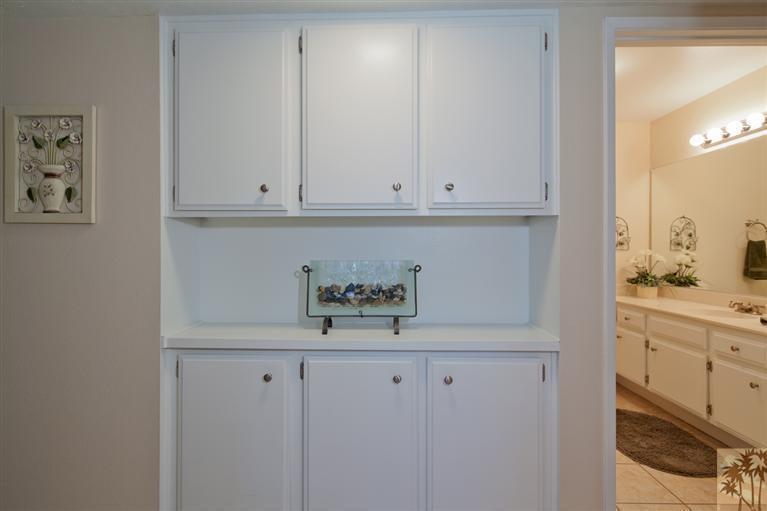 72384 Ridgecrest Lane Palm Desert, CA 92260 - Photo 18 of 23 a view of kitchen with white cabinets and a refrigerator