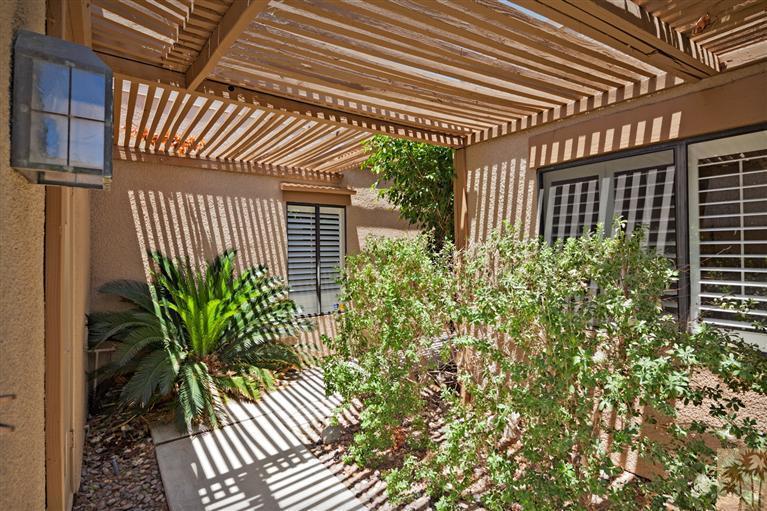 72384 Ridgecrest Lane Palm Desert, CA 92260 - Photo 3 of 23 a house with a flower garden