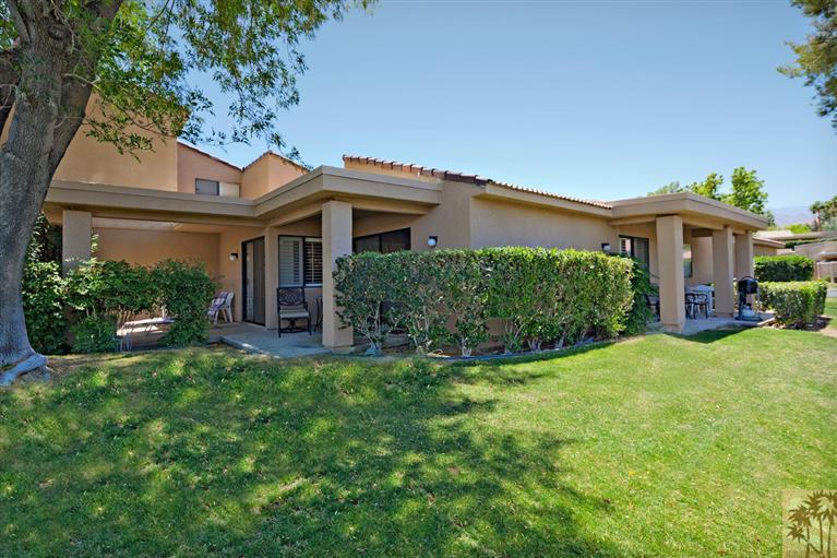 72384 Ridgecrest Lane Palm Desert, CA 92260 - Photo 5 of 23 a front view of a house with a yard