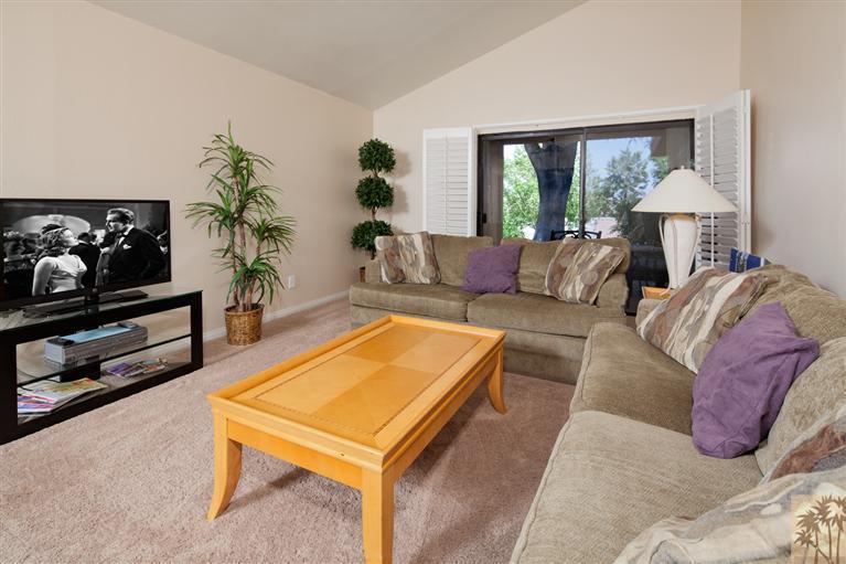 72384 Ridgecrest Lane Palm Desert, CA 92260 - Photo 7 of 23 a living room with furniture and a flat screen tv