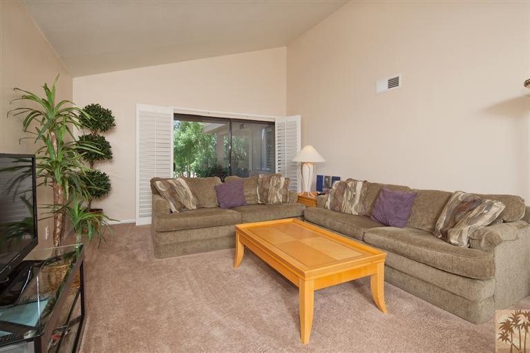 72384 Ridgecrest Lane Palm Desert, CA 92260 - Photo 8 of 23 a living room with furniture and a potted plant