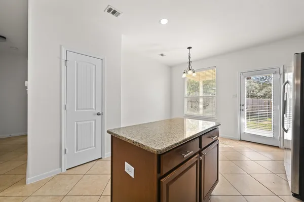 a kitchen with granite countertop a sink and a granite counter tops