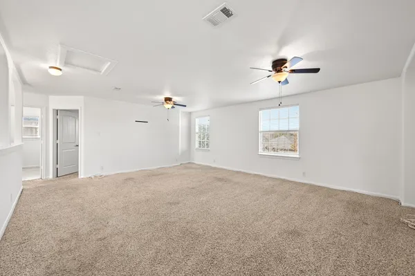 a view of empty room with windows