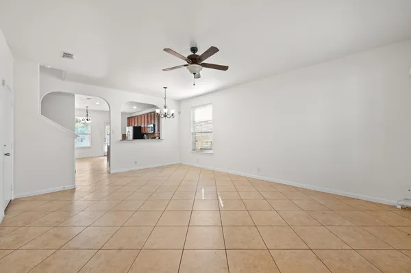 a view of an empty room and a window