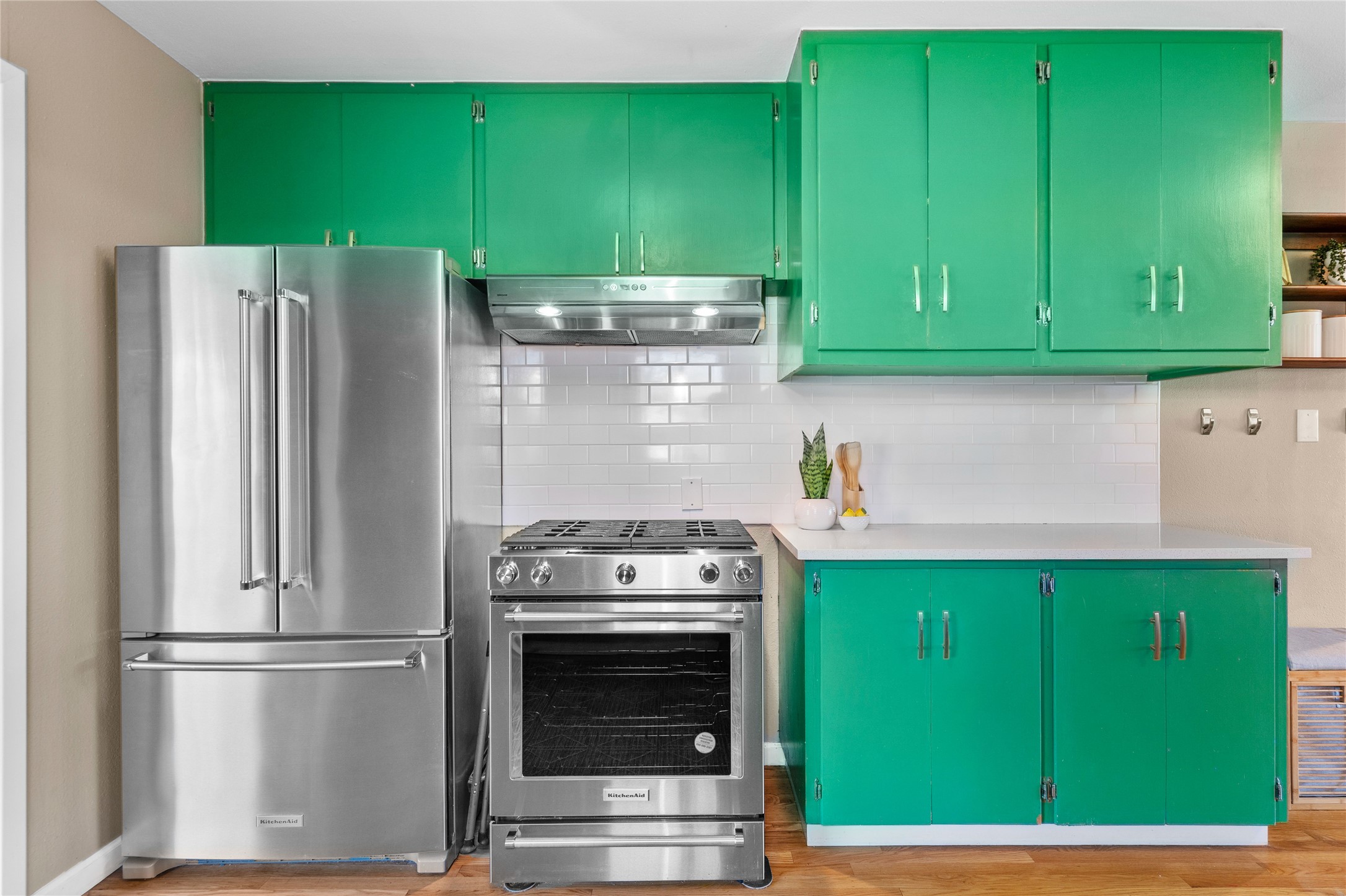 5505 Joe Sayers Avenue Austin, TX 78756 - Photo 11 of 29 Kitchen features quartz countertops and KitchenAid stainless appliances.