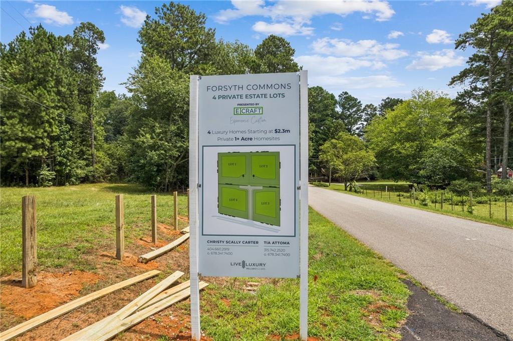 8450 Forsyth Commons Cumming, GA 30041 - Photo 7 of 11 a sign on the side of a building