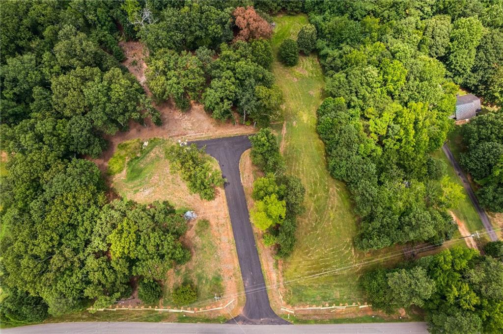 8450 Forsyth Commons Cumming, GA 30041 - Photo 10 of 11 an aerial view of a residential houses with yard