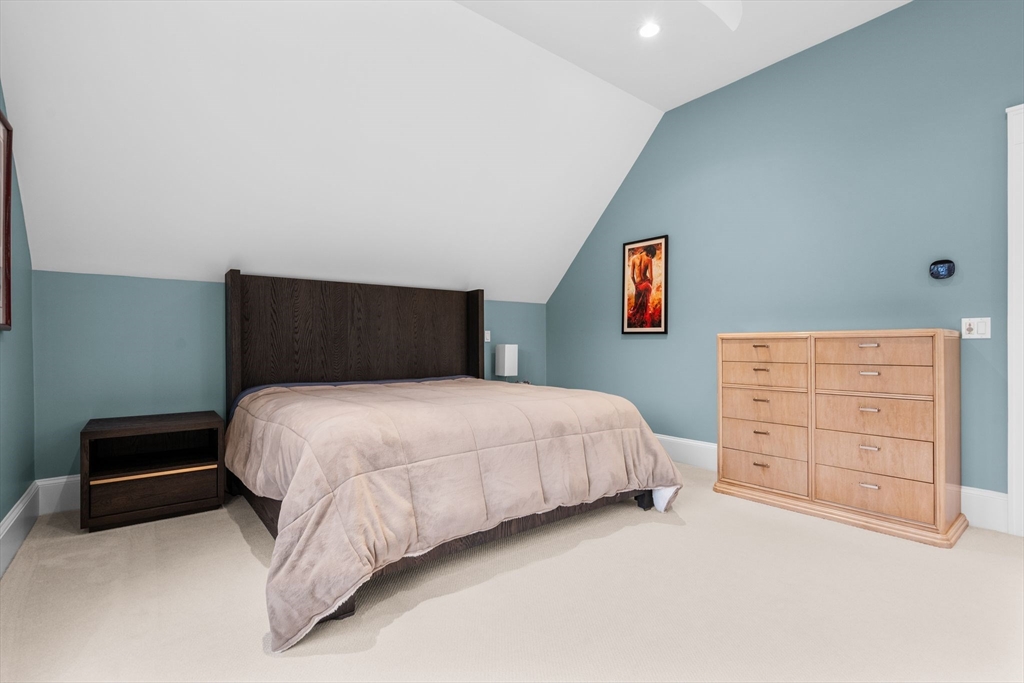 32 Standish Circle Wellesley, MA 02481 - Photo 15 of 29 a bedroom with a bed and a dresser