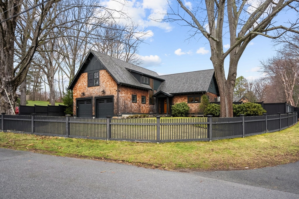 32 Standish Circle Wellesley, MA 02481 - Photo 2 of 29 a view of backyard with large trees and a small barn