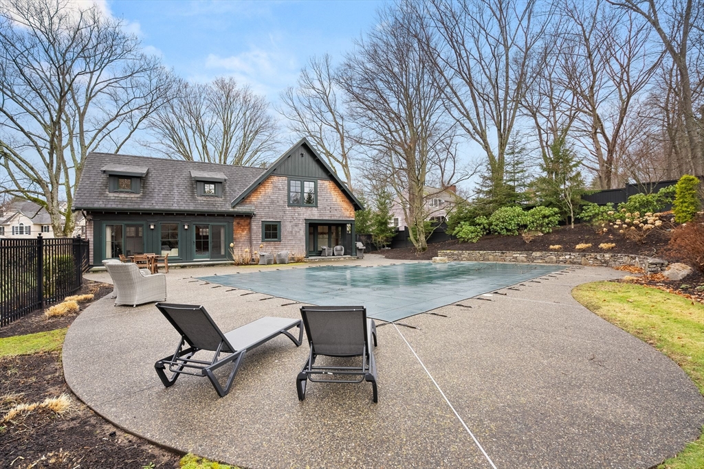 32 Standish Circle Wellesley, MA 02481 - Photo 21 of 29 a view of a house with pool and sitting area