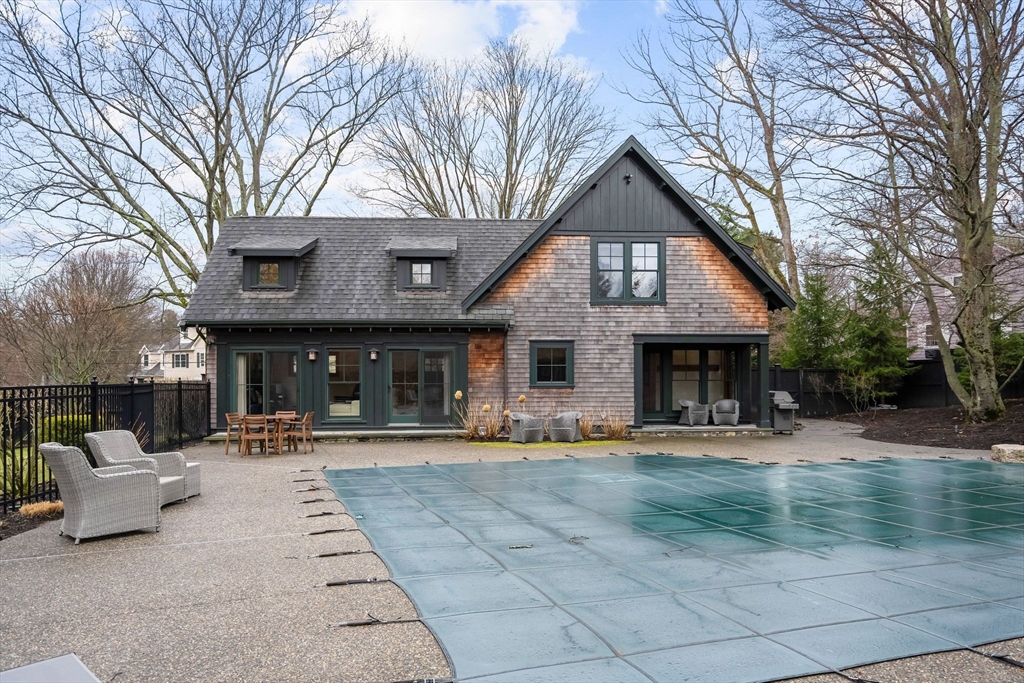 32 Standish Circle Wellesley, MA 02481 - Photo 23 of 29 a front view of a building with trees and entertaining space