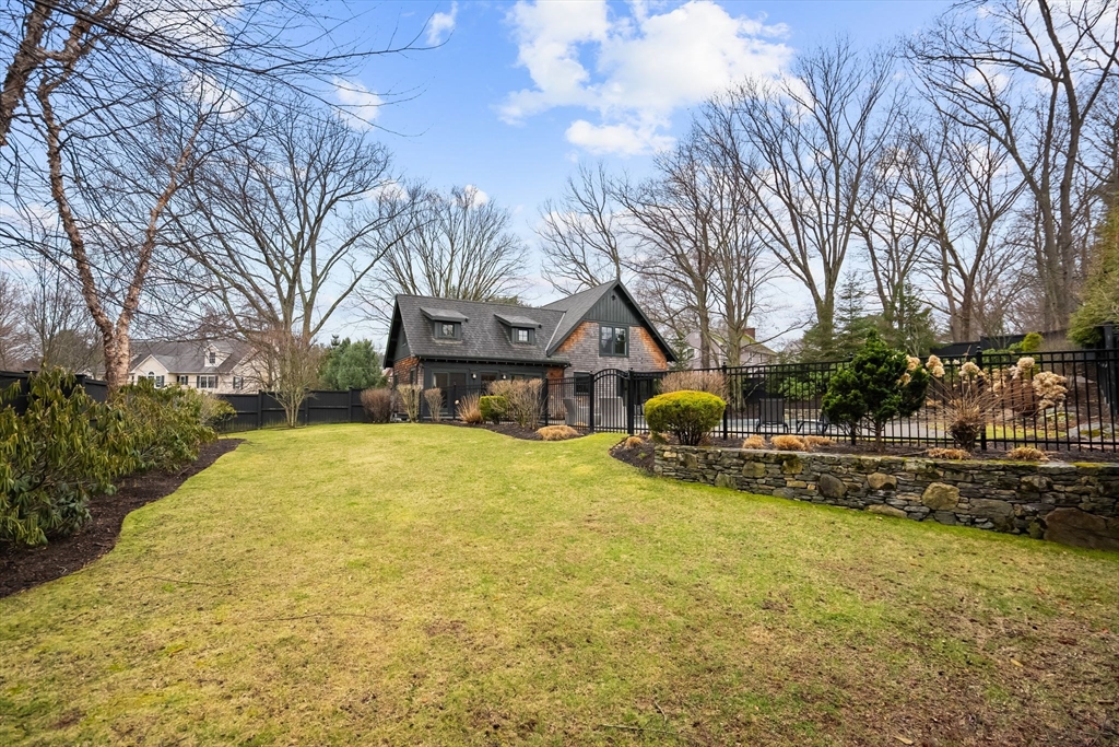 32 Standish Circle Wellesley, MA 02481 - Photo 24 of 29 a house with trees in front of it